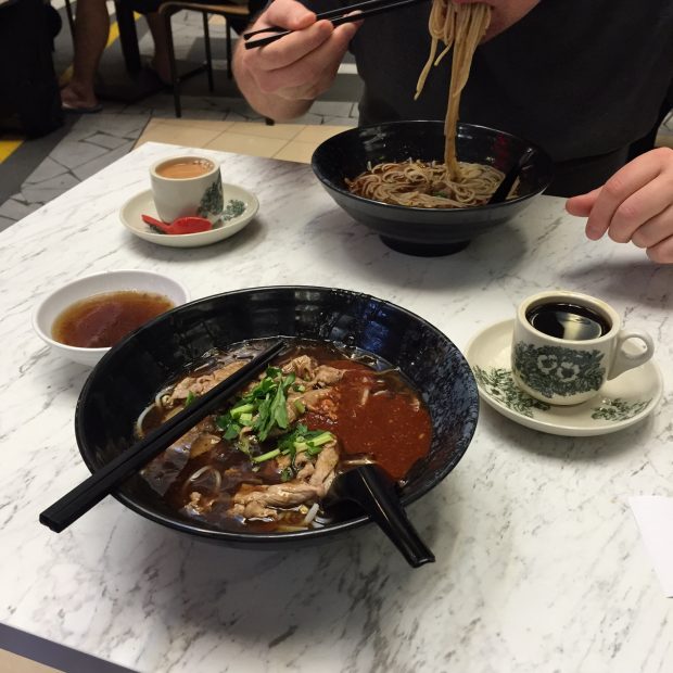 C and I eating beef noodles in Singapore